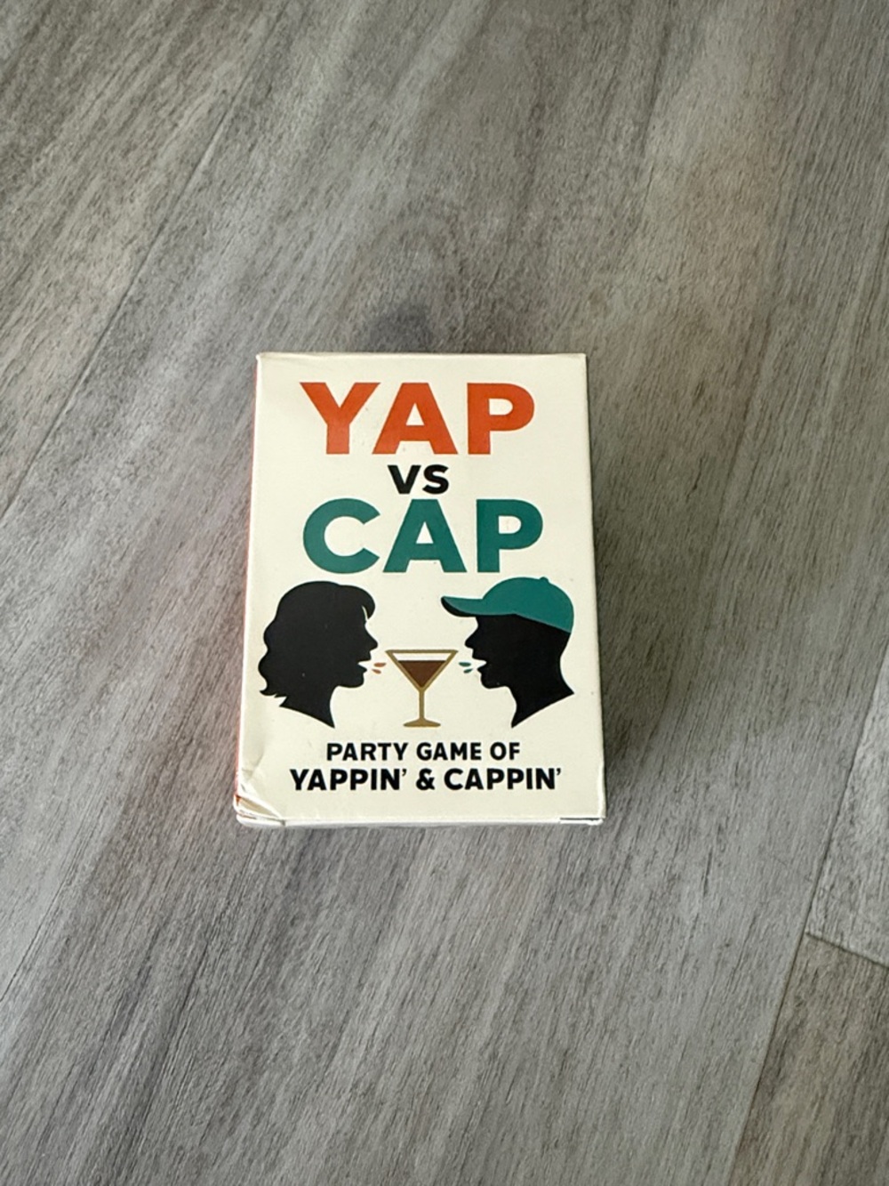 Yap vs Cap Party Game - Cream Box with Teal & Orange Graphics
